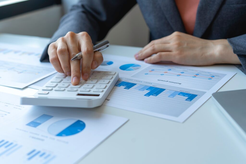business woman analyzing company performance graph Make market research reports and revenue statisti